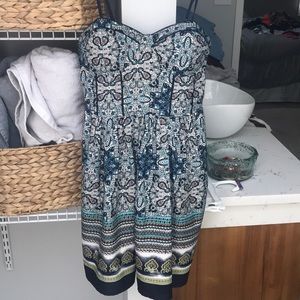 Patterned dress with structured top.